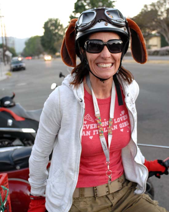 Cat-C, a Vespa scooterista from Italy...check out her cool helmet!