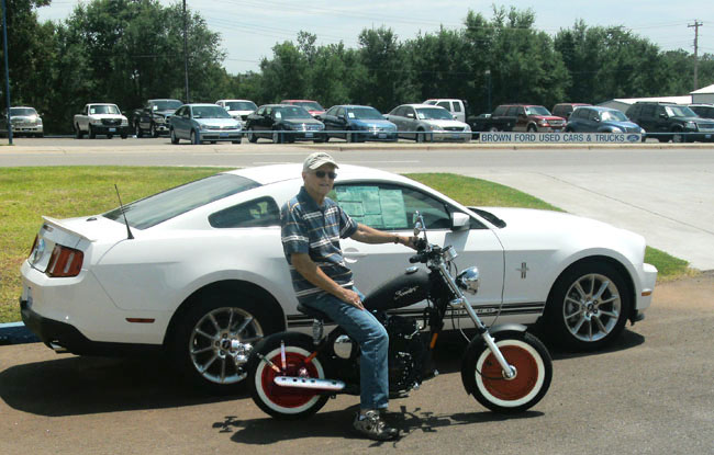RB on his new Greaser, in front of a Mustang in Cordell, Oklahoma